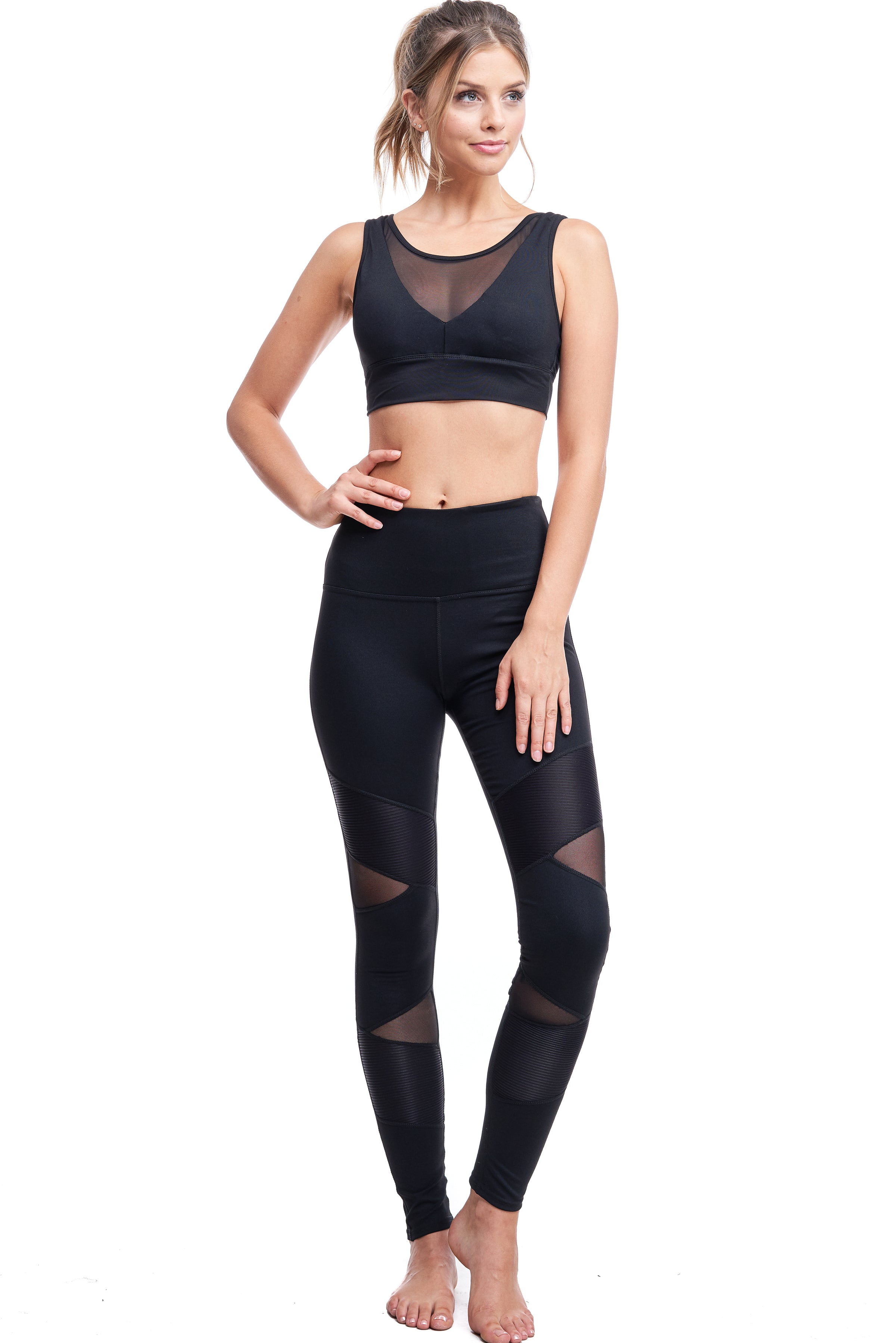 Girl wearing Shape Up Athletics mesh and satin lux leggings in black.