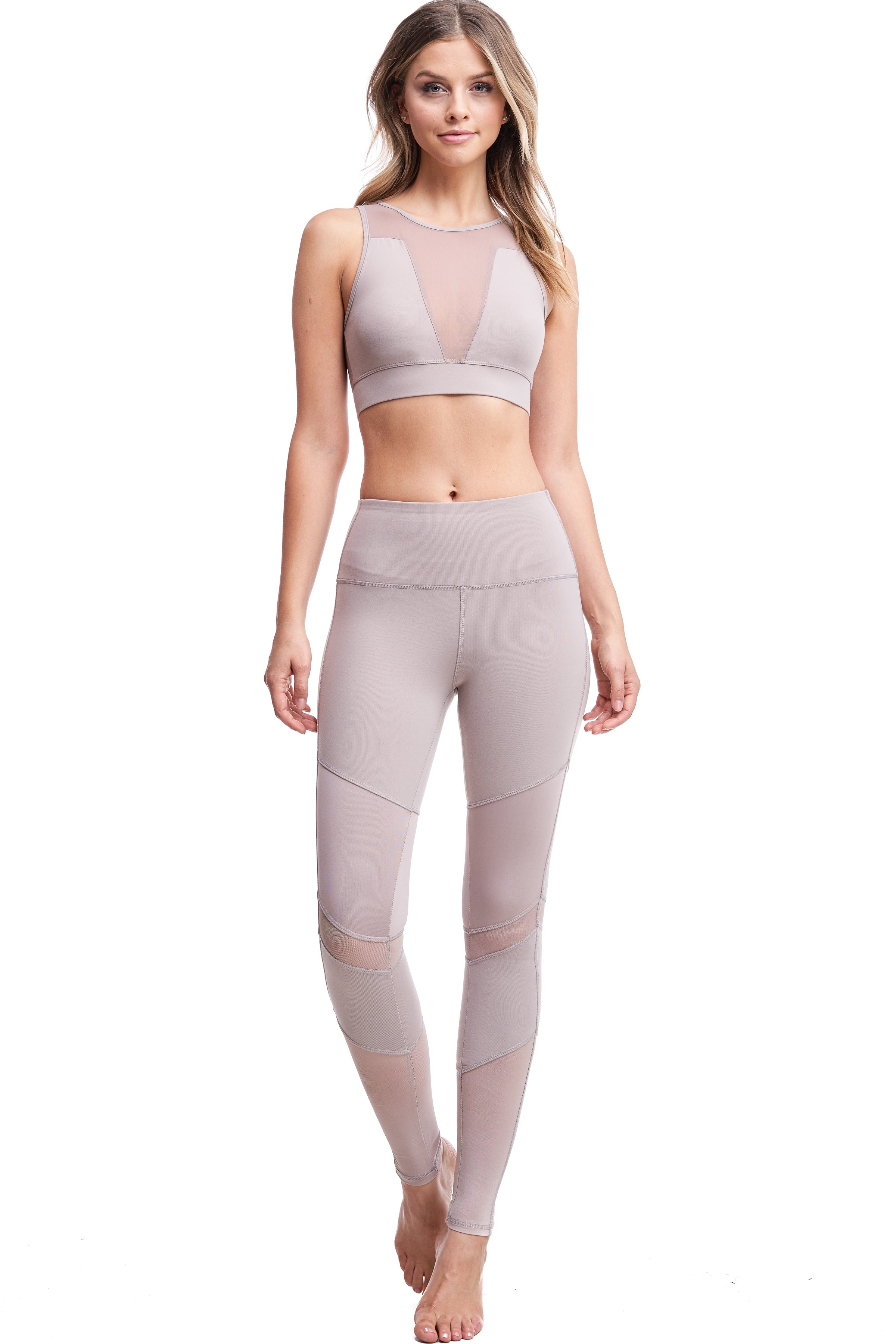 Girl wearing Shape Up Athletics Mesh and Satin Lux Leggings in nude with mesh on legs