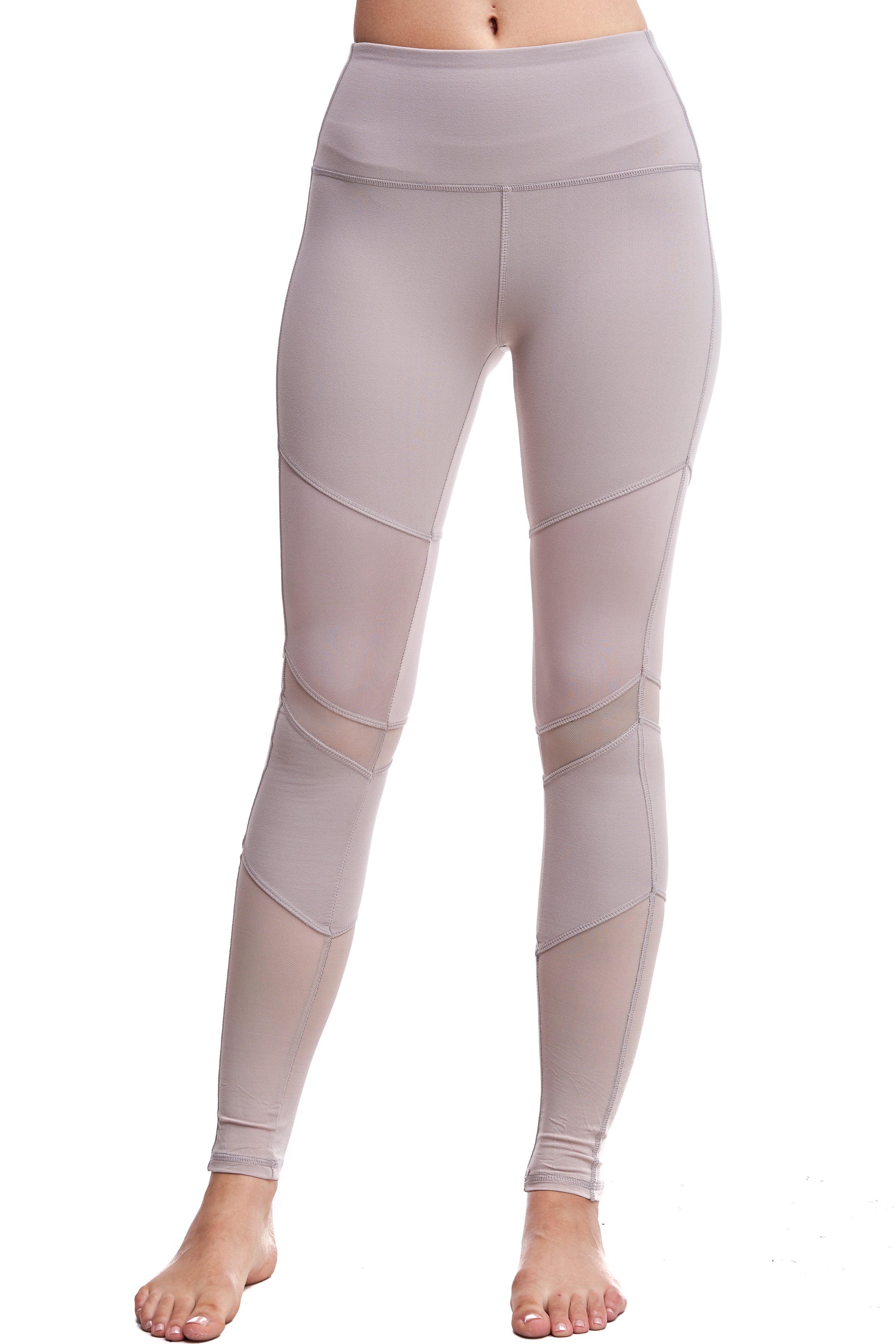 Girl wearing Shape Up Athletics Mesh and Satin Lux Leggings in nude with mesh on legs