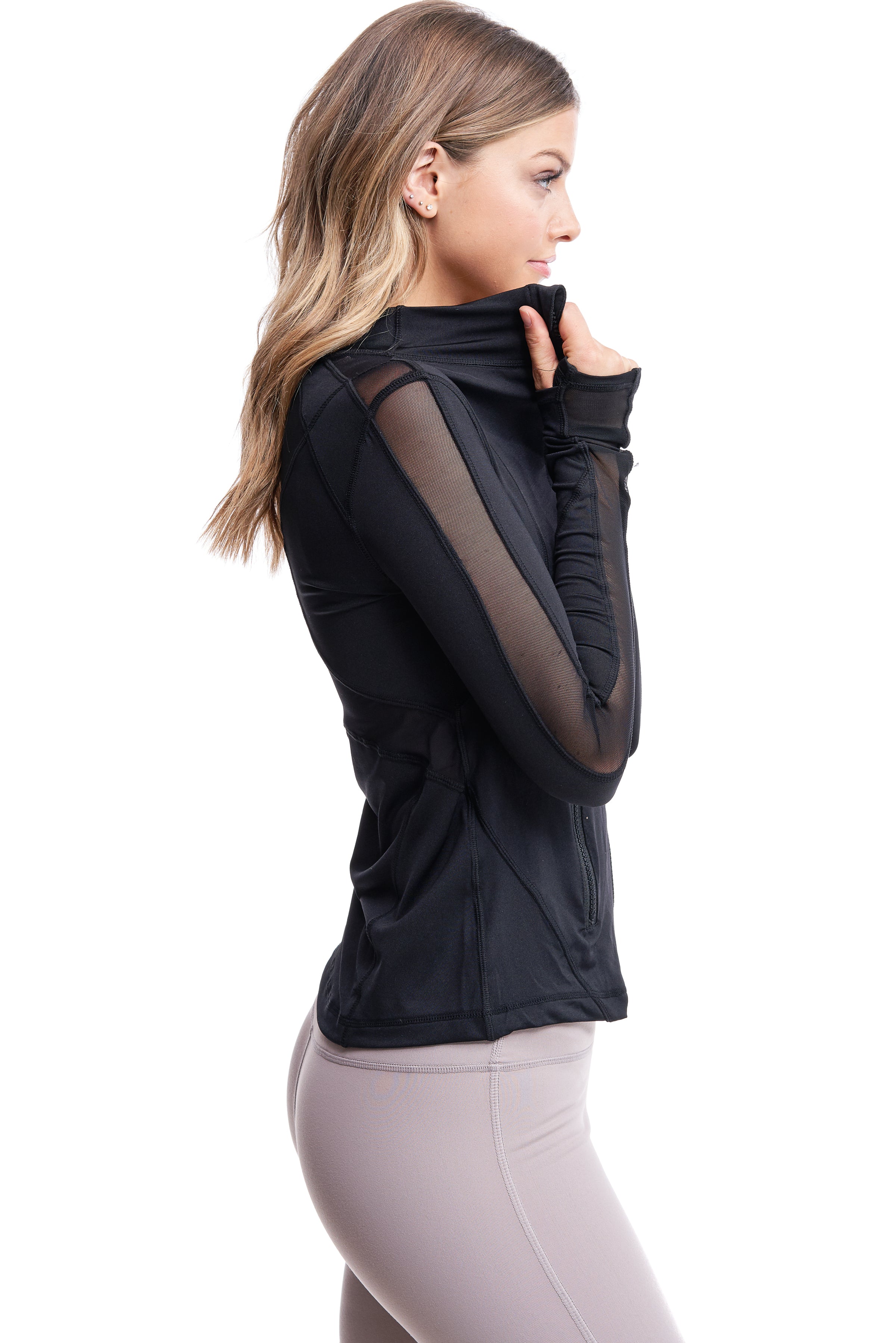 Girl wearing Shape Up Athletics "Gower" mesh jacket in black with thumb holes.