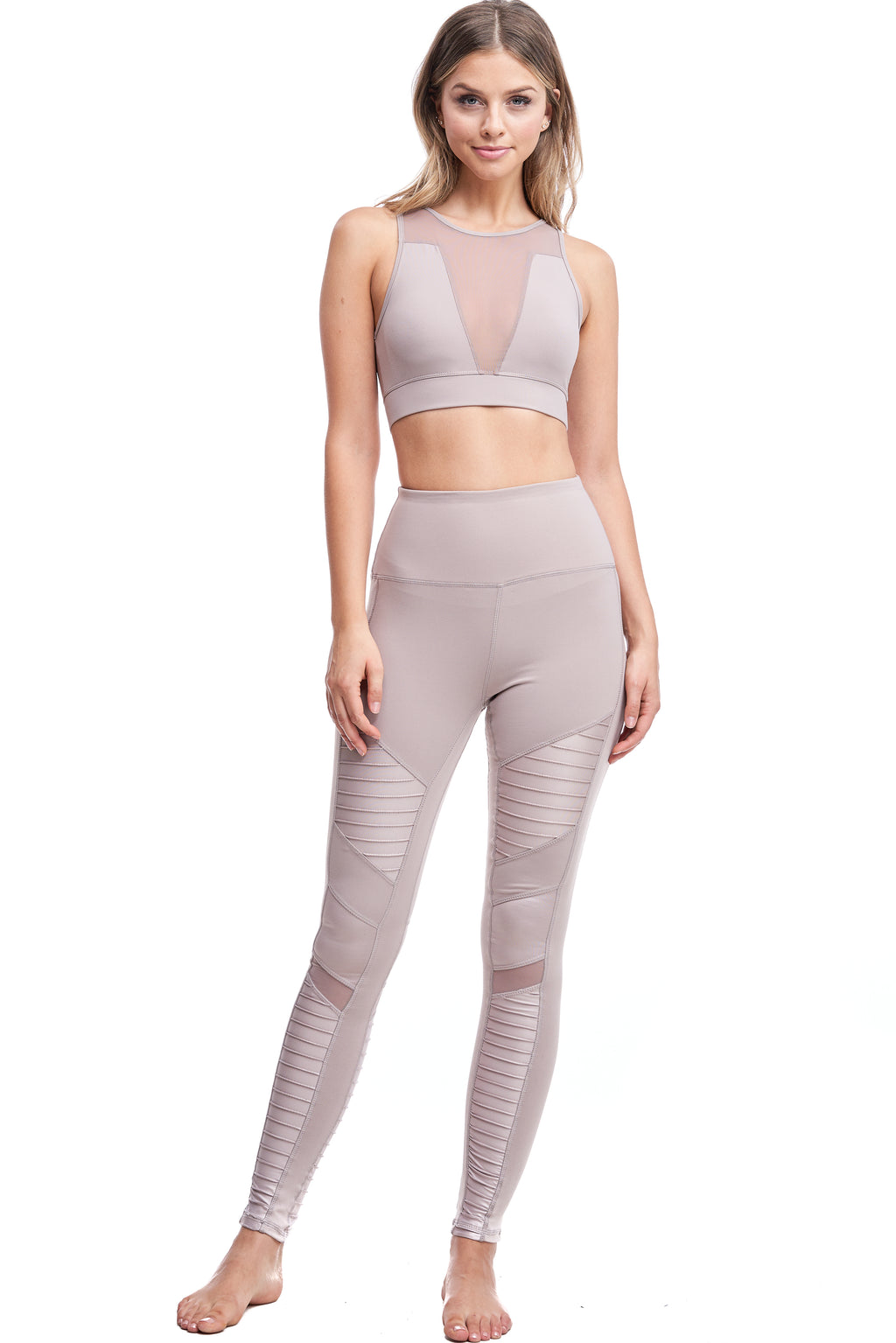 Girl wearing Shape Up Athletics "Mia" Moto Leggings in nude with mesh on legs