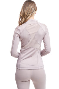 Girl wearing Shape Up Athletics "Gower" mesh jacket in nude with mesh on sleeves