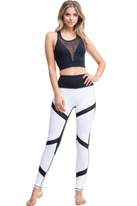 Girl wearing Shape Up Athletics Moonlight Magic Leggings with black mesh panels throughout leg.