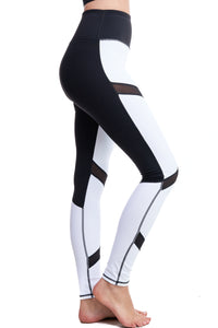 Girl wearing Shape Up Athletics Moonlight Magic Leggings with black mesh panels throughout leg.