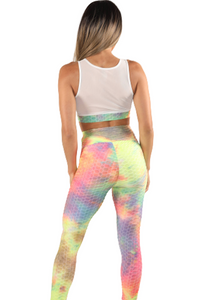 Girl wearing Shape Up Athletics popcorn textured multicolor sports bra and ruched leggings