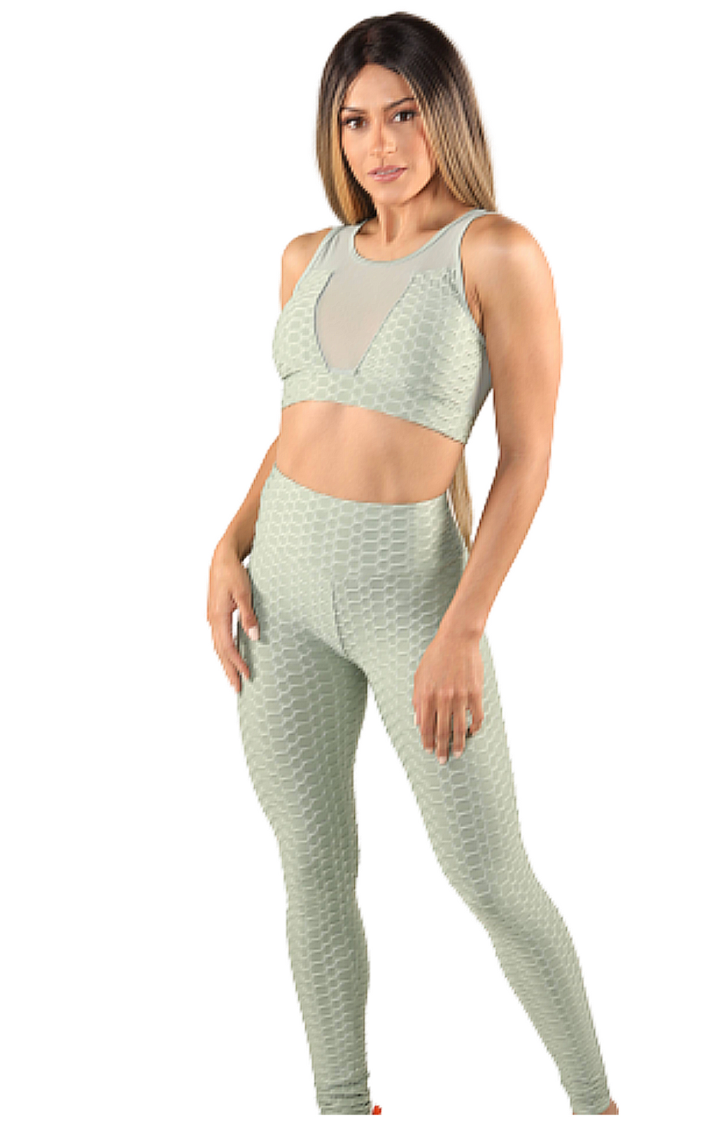 Girl wearing Shape Up Athletics popcorn textured and ruched leggings with matching sports bra in green